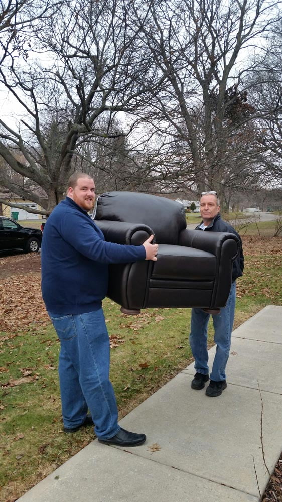 Lakeside Staff Phil & Mike delivering New leather chair to CDS